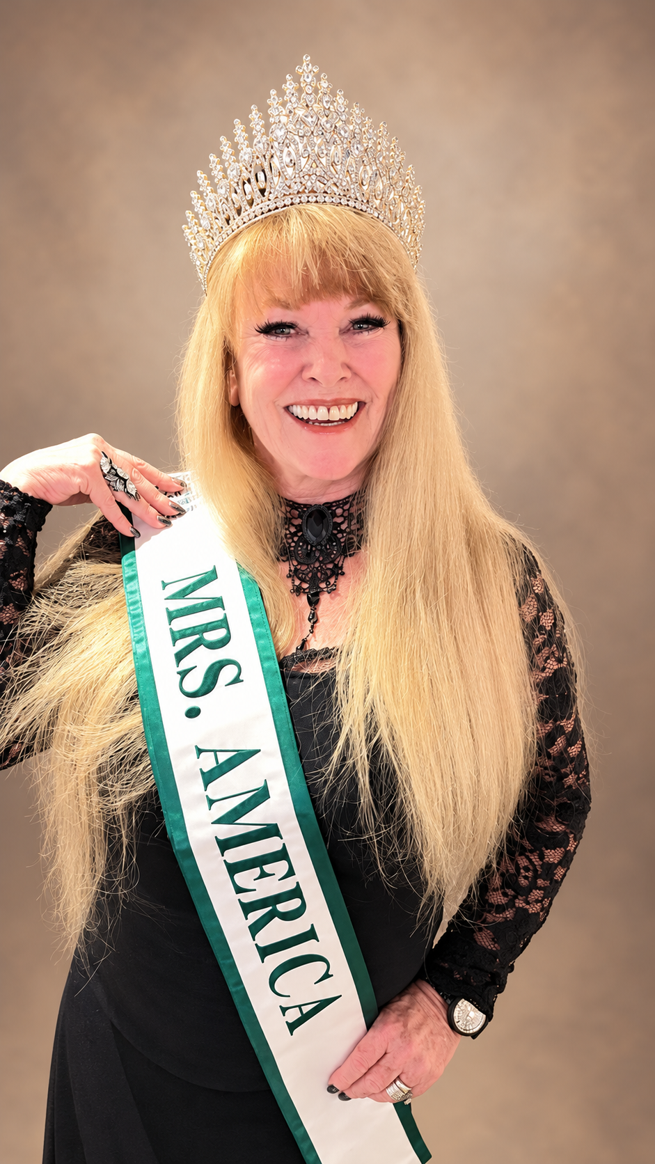 Wendy wearing her crown and Mrs. America sash
